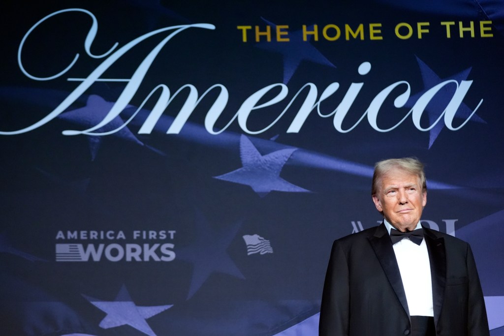 President-elect Donald Trump stands on stage during an America First Policy Institute gala at his Mar-a-Lago estate, Thursday, Nov. 14, 2024, in Palm Beach, Fla. 